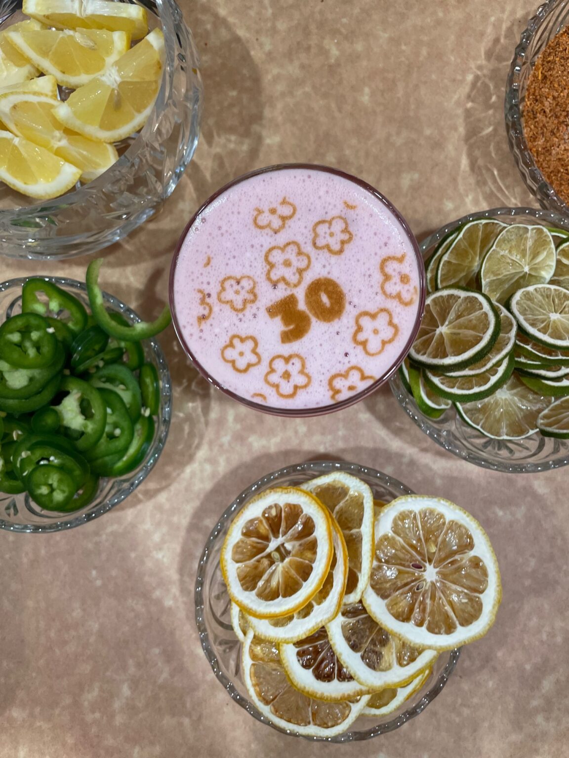 A cocktail glass with the number 30 on the foam