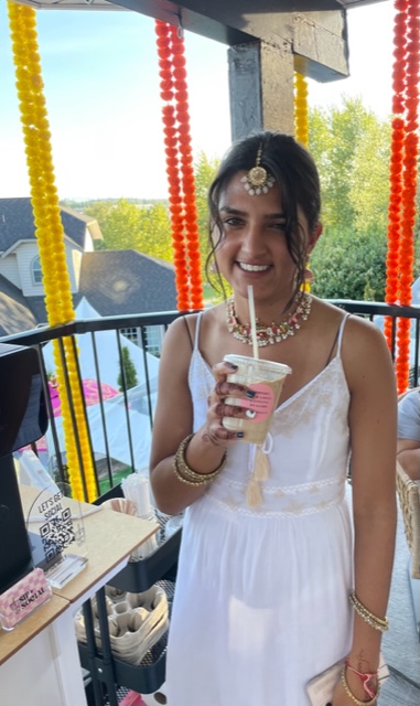 A happy Sip & Social customer sipping on their coffee at a wedding