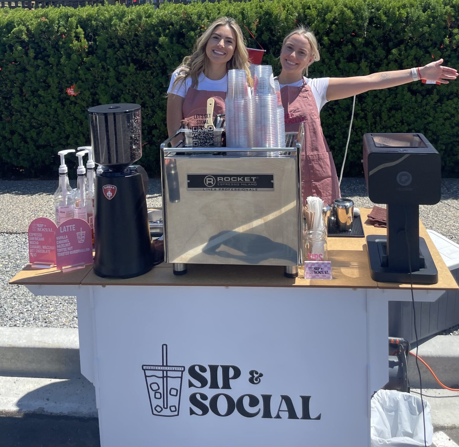 Sip & Social baristas behind their espresso machine